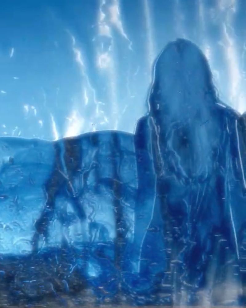 A ghostly blue figure in an icy, dreamlike projected landscape from the show's multimedia design